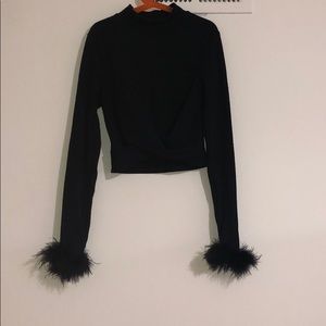 Black cropped turtle neck with fluffy cuff